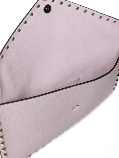 Shop Valentino Garavani Rockstud Foldover Top Clutch Bag In Water Lilac