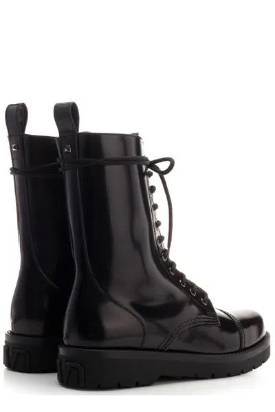 Shop Valentino Round Toe Lace-up Boots In Black