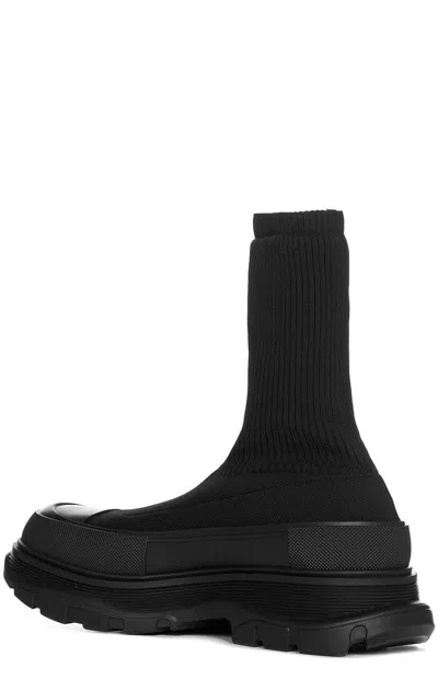 Shop Alexander Mcqueen Tread Slick Logo Intarsia Boots In Black