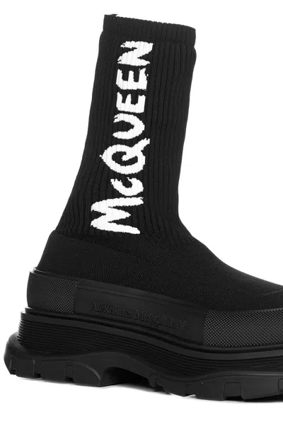 Shop Alexander Mcqueen Tread Slick Logo Intarsia Boots In Black