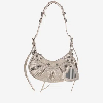 Shop Balenciaga Le Cagole Xs Metallic Shoulder Bag In Stone Beige