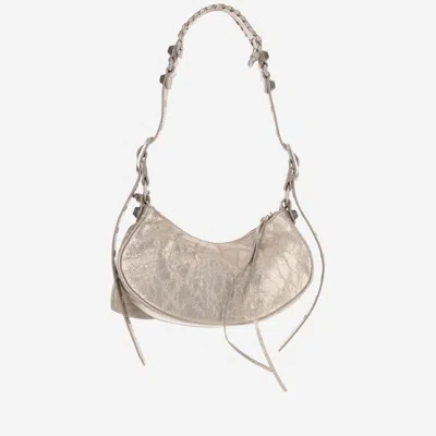 Shop Balenciaga Le Cagole Xs Metallic Shoulder Bag In Stone Beige