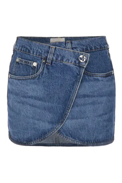 Shop Coperni Curved Hem Wrap Denim Mini Skirt Skirt In Washed Blue