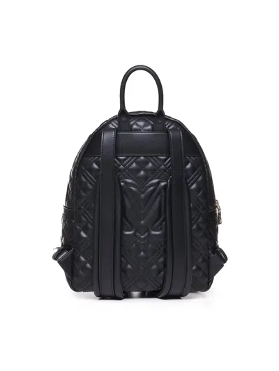 Shop Moschino Quilted Backpack With Logo In Nero