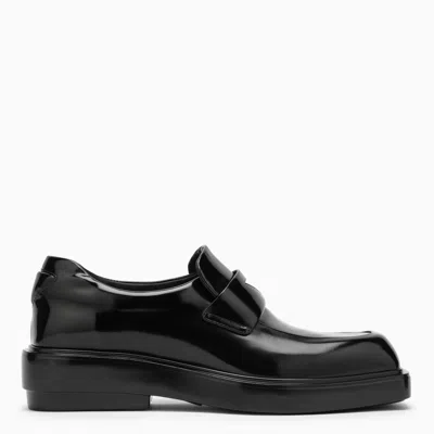 Shop Prada Black Brushed Leather Loafers In Nero
