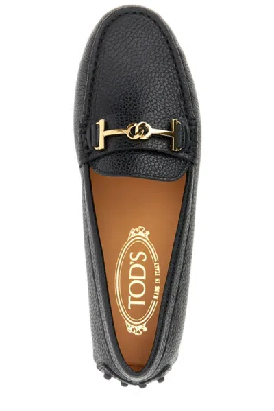 Shop Tod's Logo Plaque Round Toe Loafers In Black