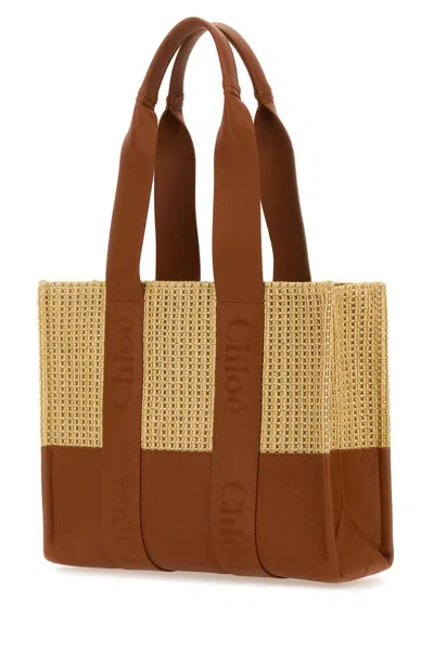 Shop Chloé Two-tone Raffia And Leather Medium Woody Shopping Bag In Marrone