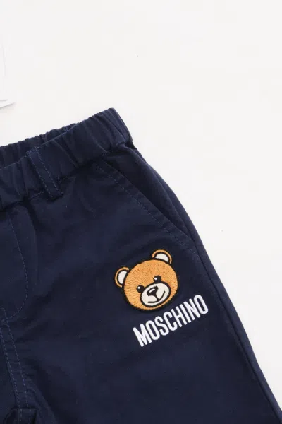 Shop Moschino Blue Trousers With Logo