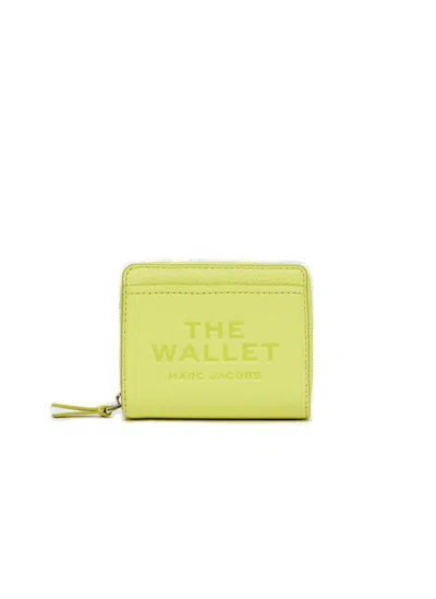 Shop Marc Jacobs Logo Printed Zipped Mini Compact Wallet In Yellow