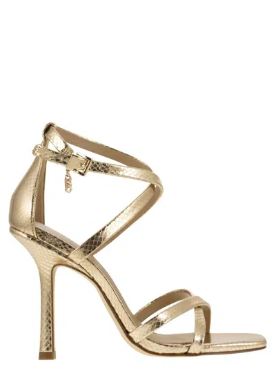 Shop Michael Kors Celia Metallic Snake Print Heeled Sandals In Gold