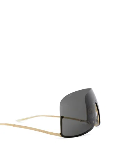 Shop Gucci Gg1560s Gold Sunglasses