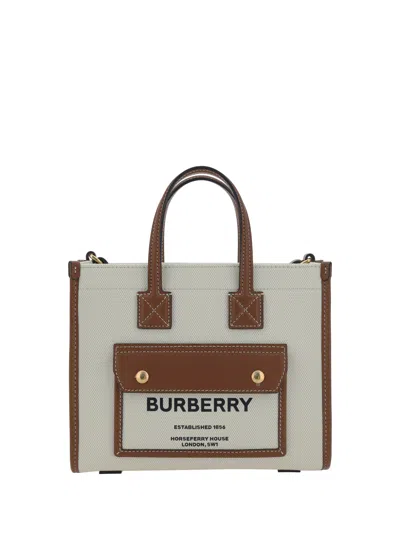 Shop Burberry Feya Handbag In Natural/tan