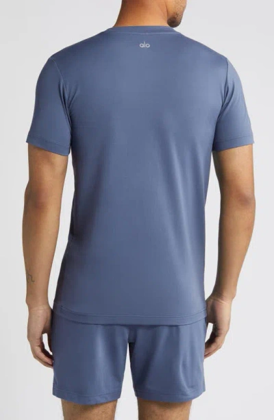 Shop Alo Yoga Conquer Reform Performance Crewneck T-shirt In Bluestone