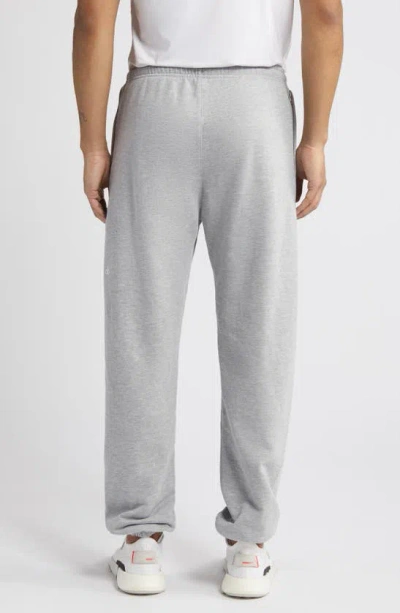 Shop Alo Yoga Chill Drawstring Sweatpants In Athletic Htr Gry