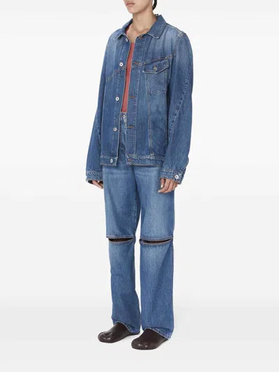 Shop Jw Anderson Cut-out Bootcut Jeans In Dark Wash