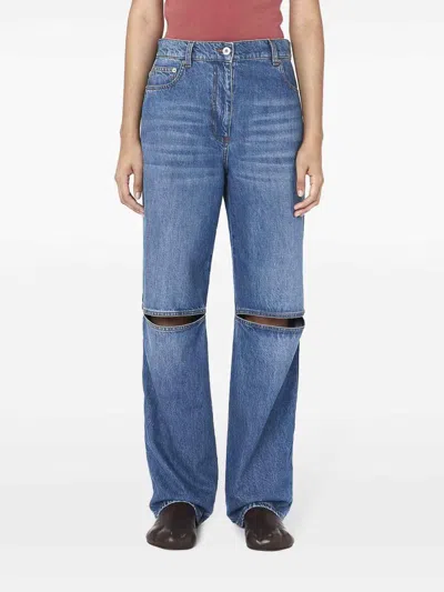 Shop Jw Anderson Cut-out Bootcut Jeans In Dark Wash