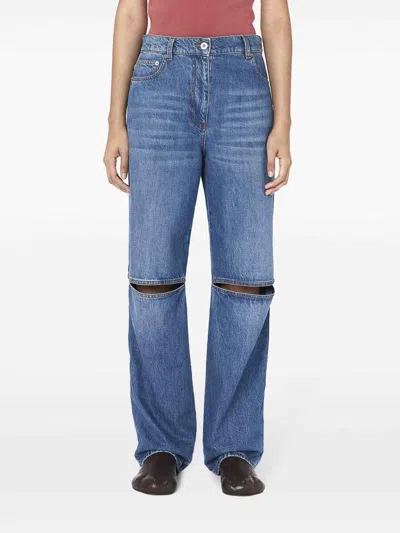 Jw Anderson Cut-out Bootcut Jeans In Dark Wash