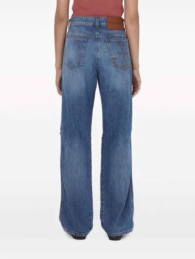 Jw Anderson Cut-out Bootcut Jeans In Dark Wash
