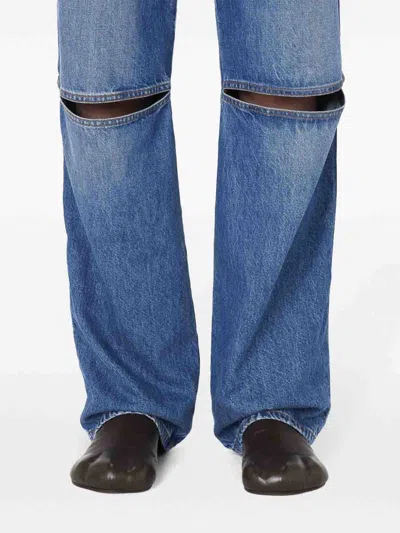 Jw Anderson Cut-out Bootcut Jeans In Dark Wash