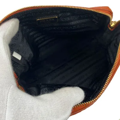 Shop Prada Saffiano Orange Leather Clutch Bag ()