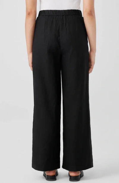 Shop Eileen Fisher Pleated High Waist Organic Linen Wide Leg Pants In Black