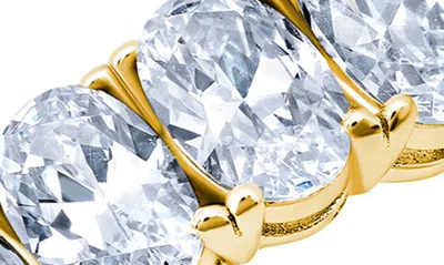 Shop Crislu Oval Cut Eternity Band Ring In Gold