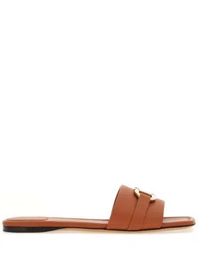 Shop Ferragamo Gancini Leather Flat Sandals In Brown