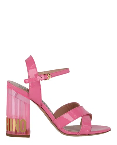 Shop Moschino Patent Leather Logo Heel Sandals In Pink