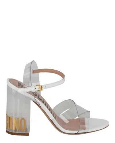 Shop Moschino Transparent Logo Heel Sandals In Multi