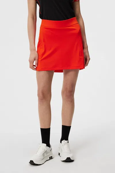 Shop J. Lindeberg Amelie Mid Golf Skirt In Tangerine Tango In Red