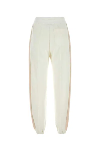 Shop Gucci Pants In White