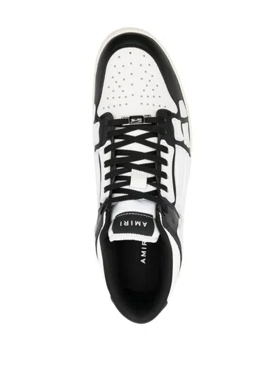 Shop Amiri 'skel Top Low' Sneakers In Nero E Bianco
