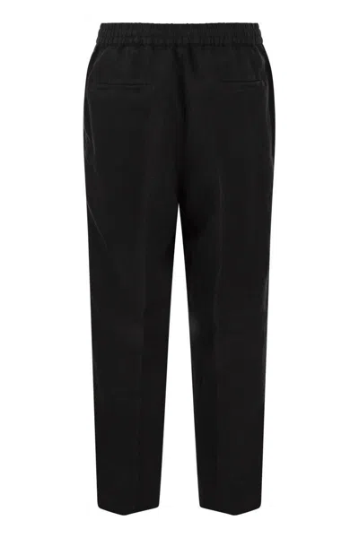 Shop Brunello Cucinelli Leisure Fit Trousers In Garment-dyed Linen Gabardine With Drawstring And Double D In Black
