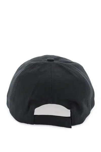 Shop Ganni Caps In Black