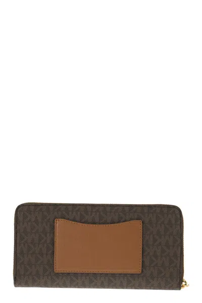 Shop Michael Kors Continental Wallet With Printed Canvas In Brown