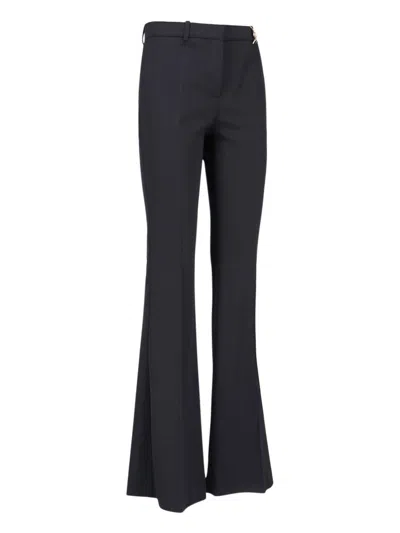 Shop Versace Trousers Black
