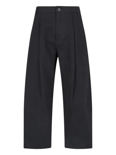 Shop Studio Nicholson Trousers In Black