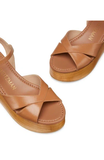 Shop Stuart Weitzman Carmen Midi Wedge Sandal In Tan/ Sand