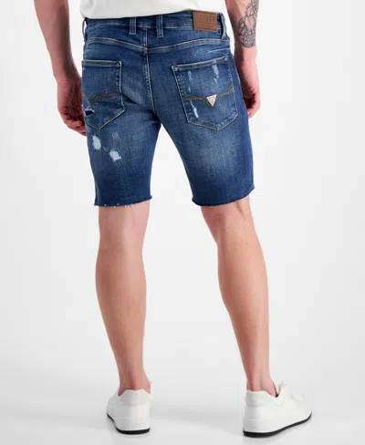 Shop Guess Logan Distressed 9" Denim Shorts In Lido