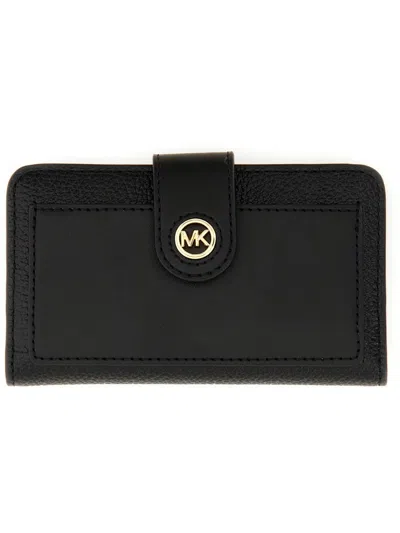 Shop Michael Michael Kors Logo Plaque Bifold Wallet In Black