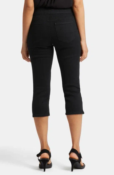 Shop Nydj Dakota Side Slit Pull-on Capri Jeans In Overdye Black