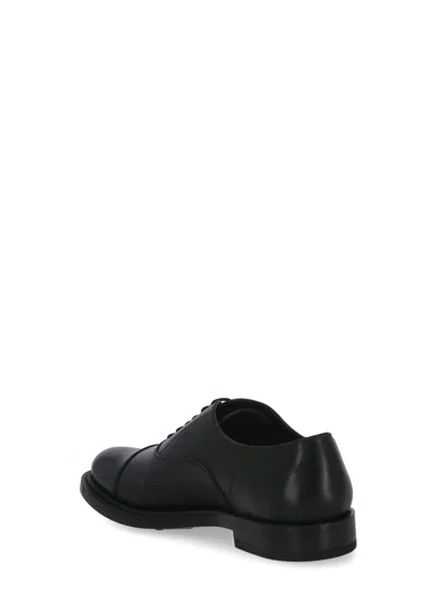 Shop Tod's Flat Shoes Black