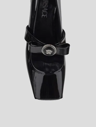 Shop Versace Flat Shoes In Blackpalladium