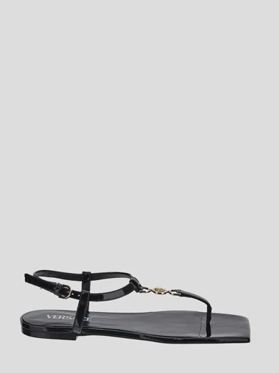 Shop Versace Sandals In Neroro