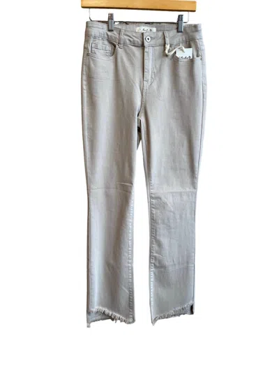 Shop Charlie B Asymmetrical Hem Bootcut Jean In Almond In Silver