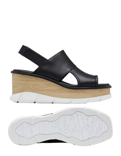 Shop Sorel Joanie Slingback Wedge Sandals In Black/white