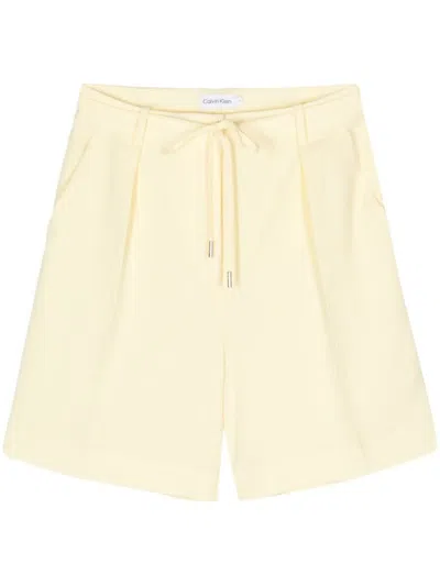 Shop Calvin Klein Structure Twill Shorts Clothing In Yellow & Orange