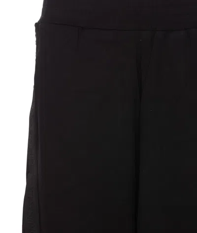 Shop Hinnominate Trousers In Black