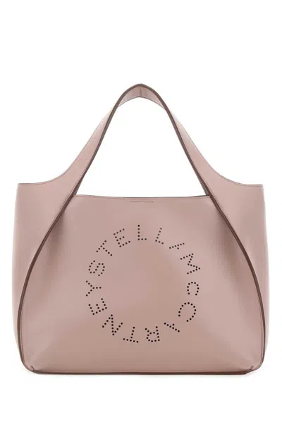 Shop Stella Mccartney Logo Embossed Top Handle Bag In Powder