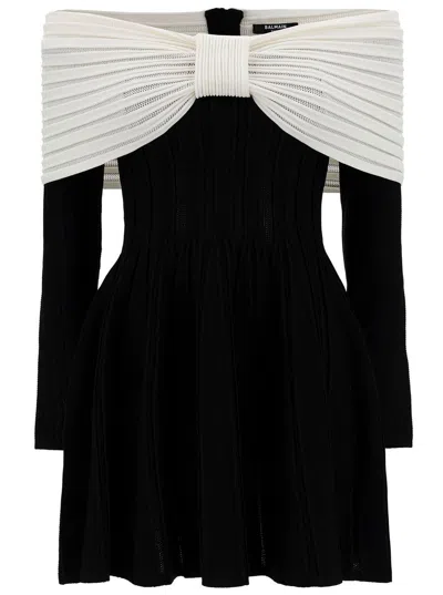 Shop Balmain Mini Black Dress With Off-the-shoulder Bow Neckline In Textured Knit Woman In White/black